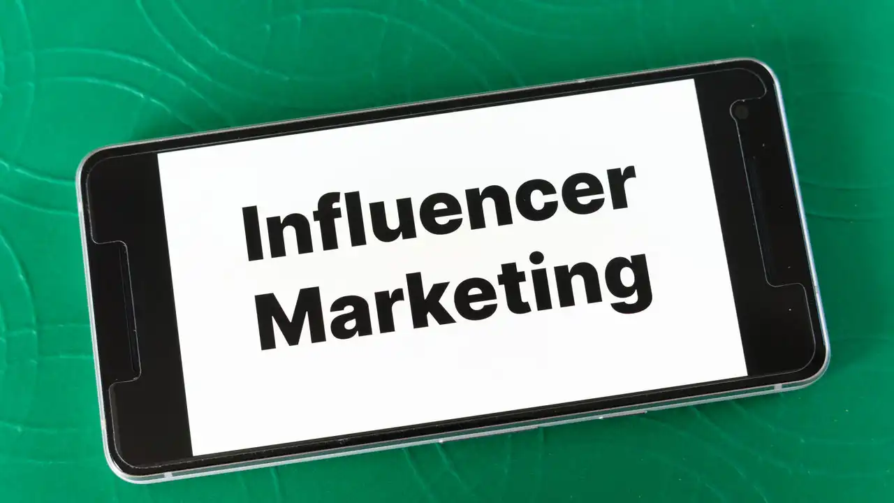 Phone screen with the word 'Influencer Marketing' 